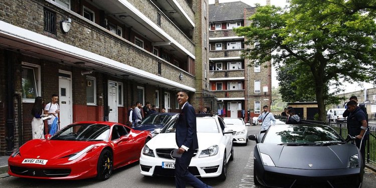 16, walks past cars parked