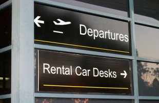 Airport departures and rental vehicle desks airport indications